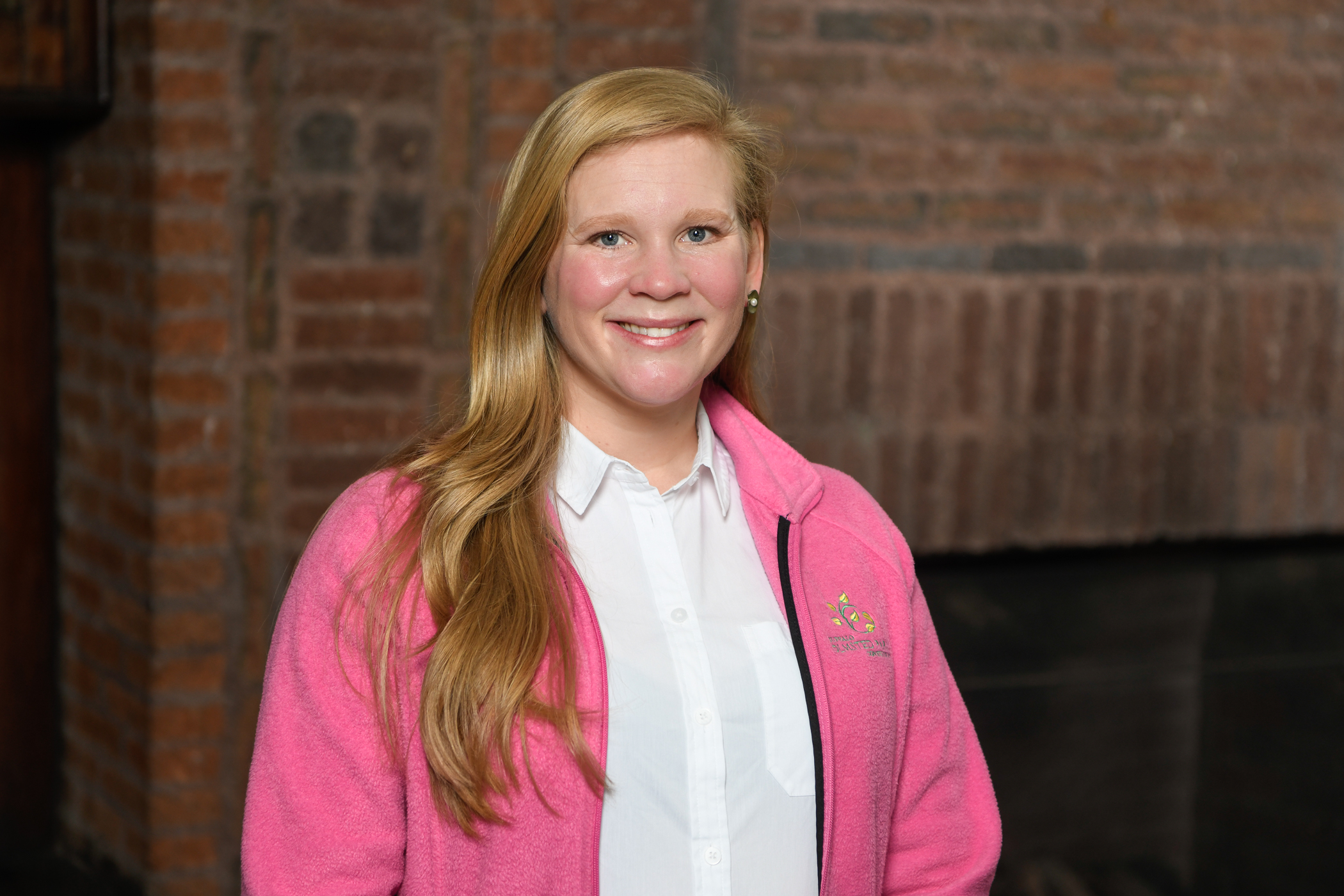 Photo of Catie Stephenson, wearing a pink fleece