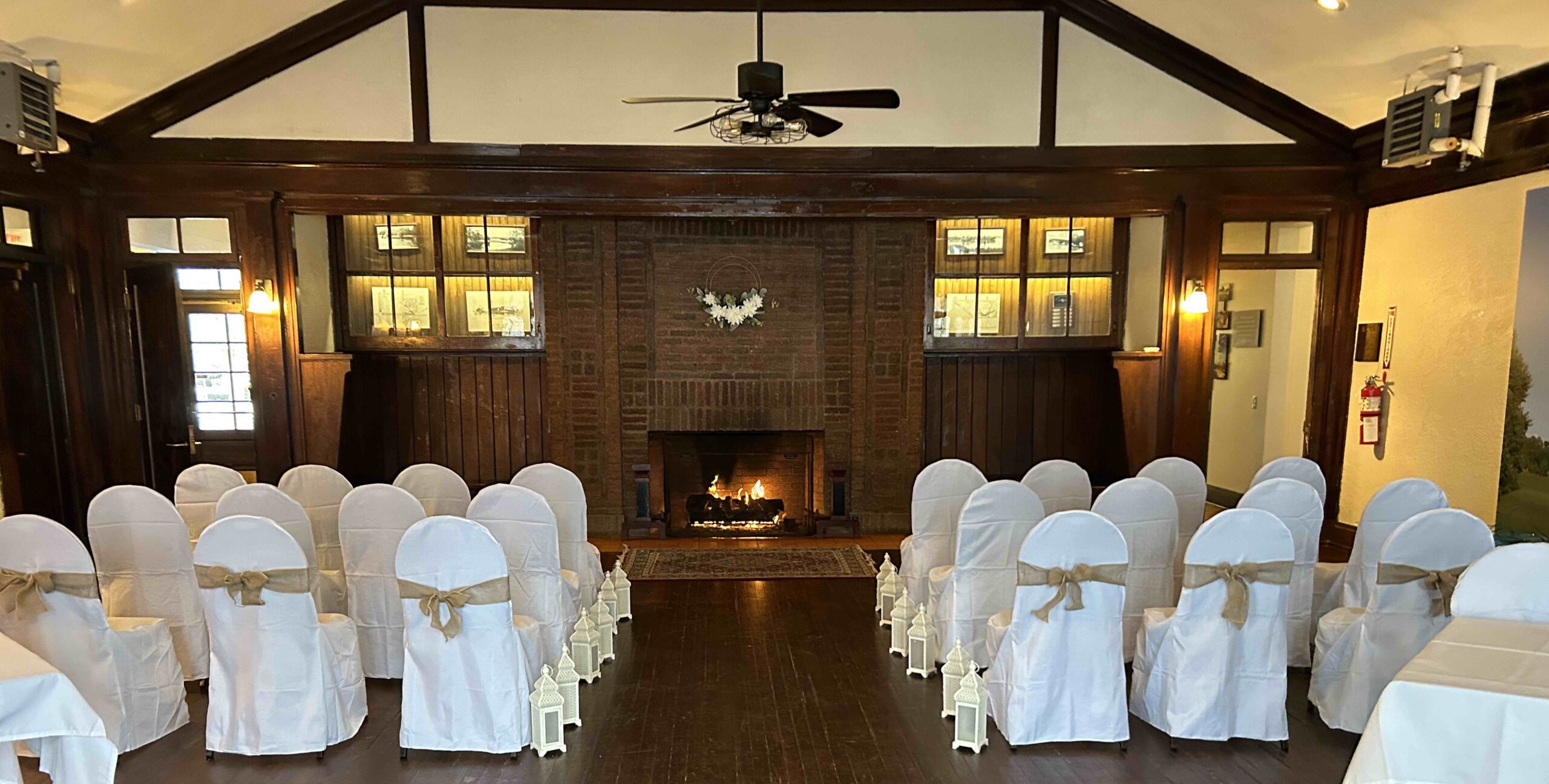 Chairs in white linen for a wedding ceremony at the Parkside Lodge