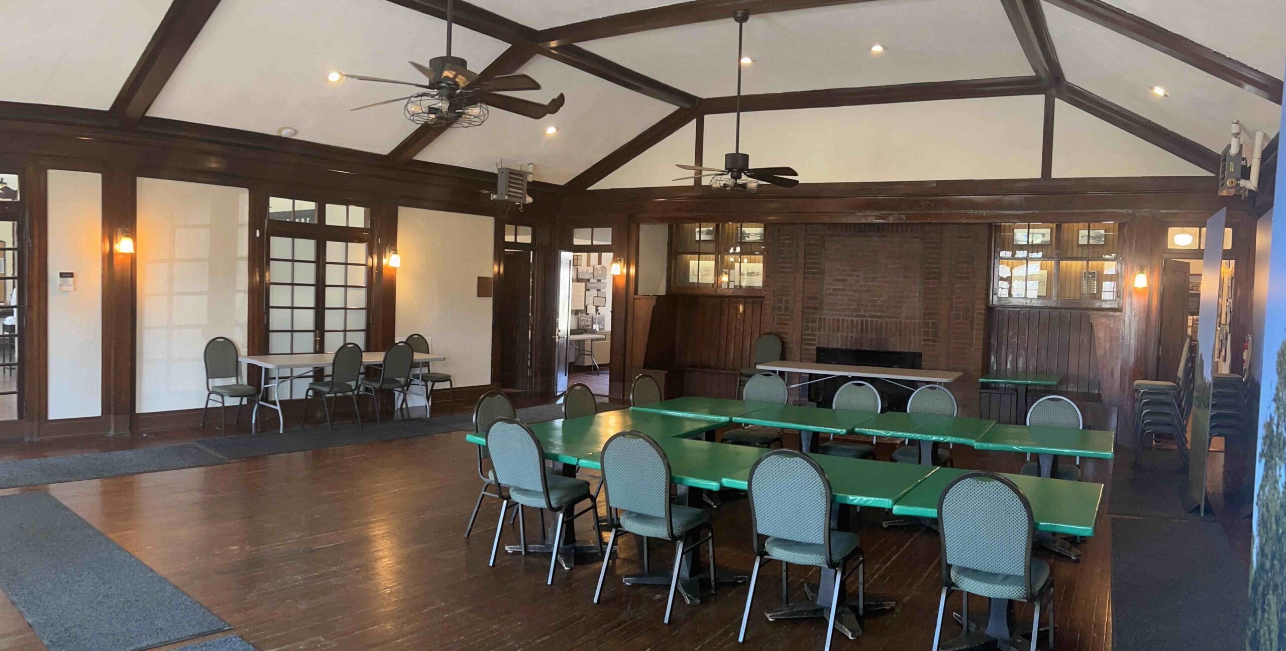 View of Parkside Lodge, with green chairs and tables